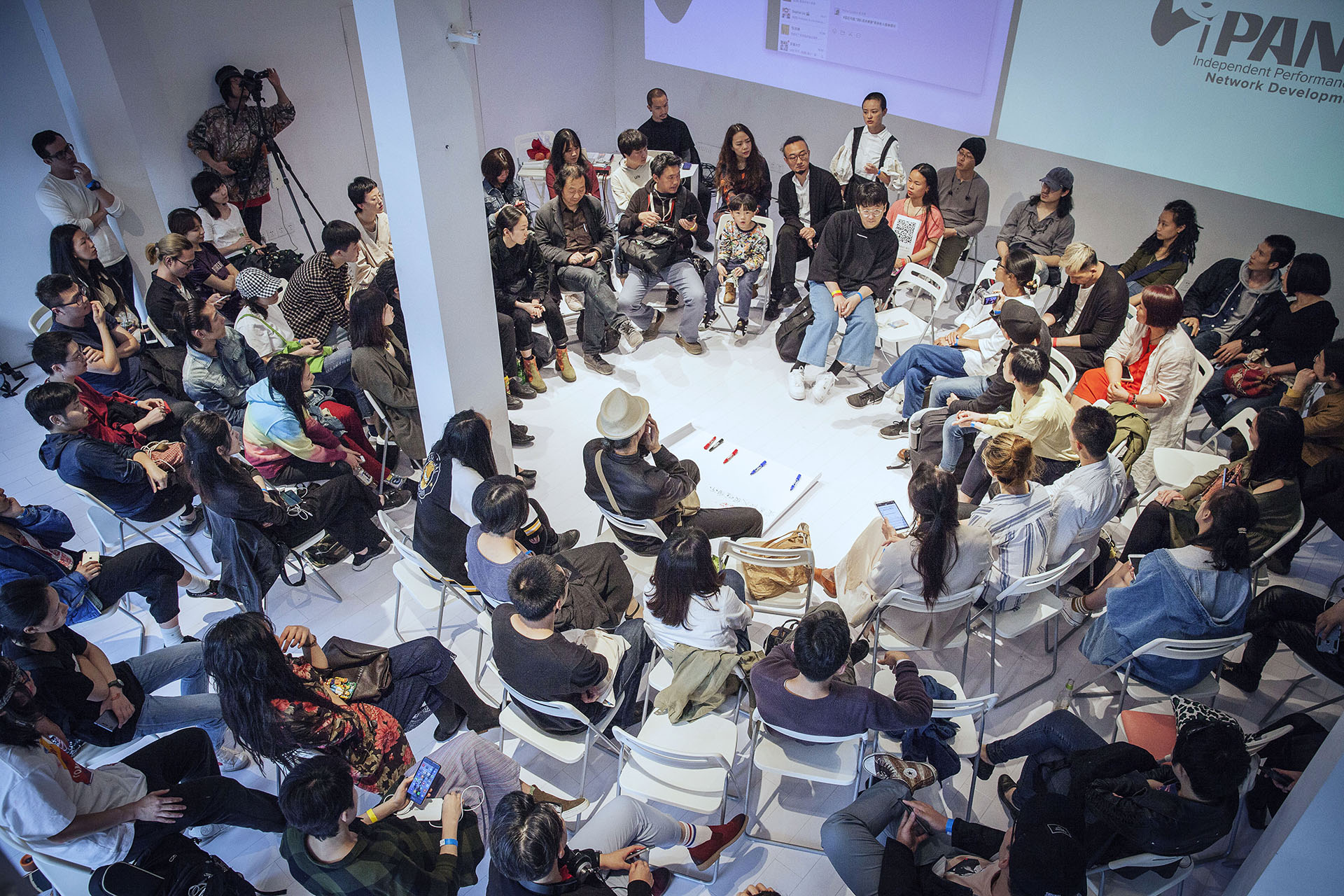 Participants seated in a circle at an iPANDA gathering